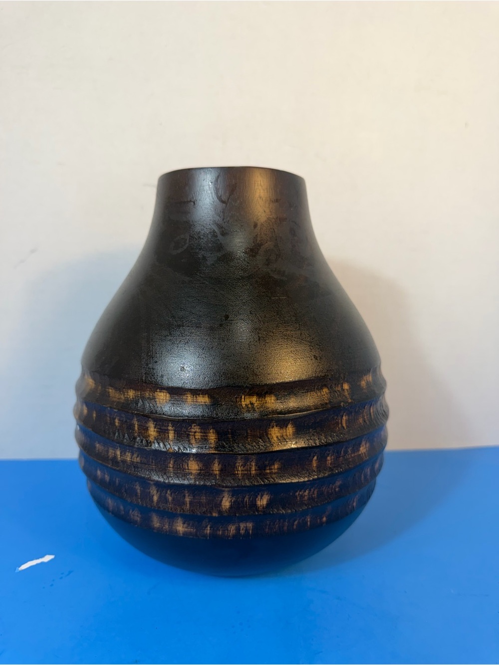 hand-carved wooden vase with contrasting texture